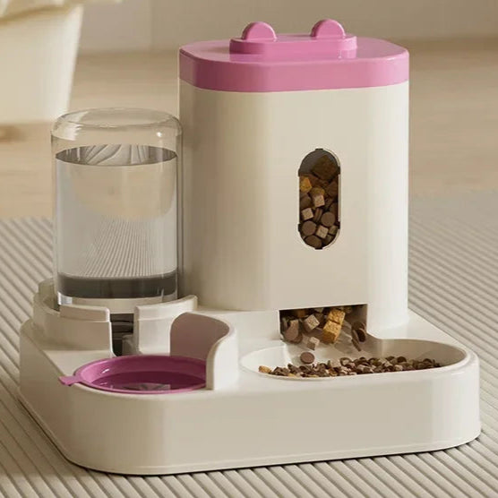 Pet feeder and water dispenser with pink top on a neutral background