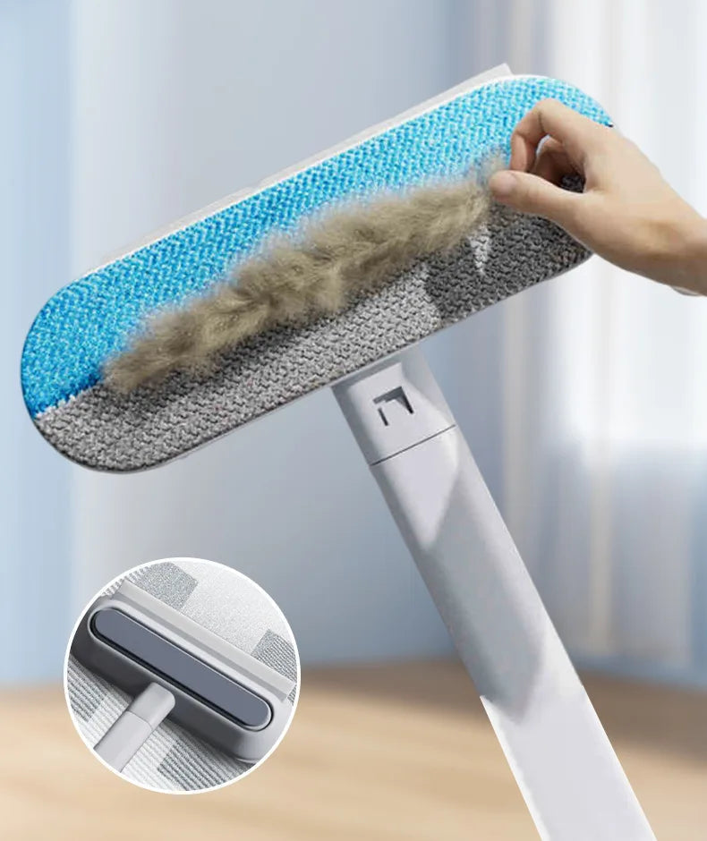 Cleaning tool with a brush head being used to remove hair, against a light blue background.